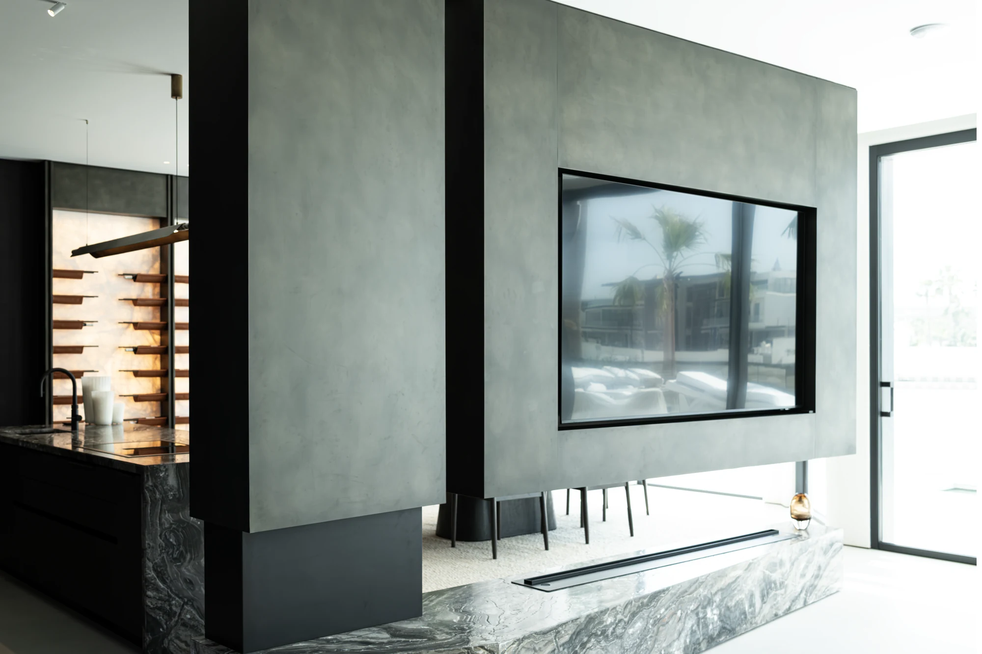 Bespoke TV feature with marble base and integrated fireplace at the Karigar F10 project