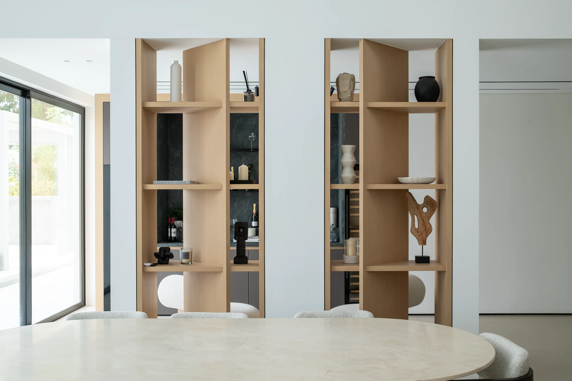 Bespoke oak display shelving and room divider by Karigar at Villa 14