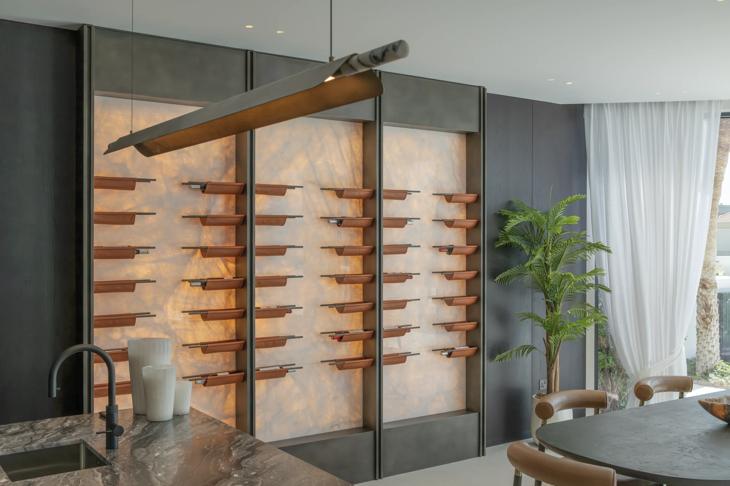 Bespoke illuminated wine display and cabinetry by Karigar