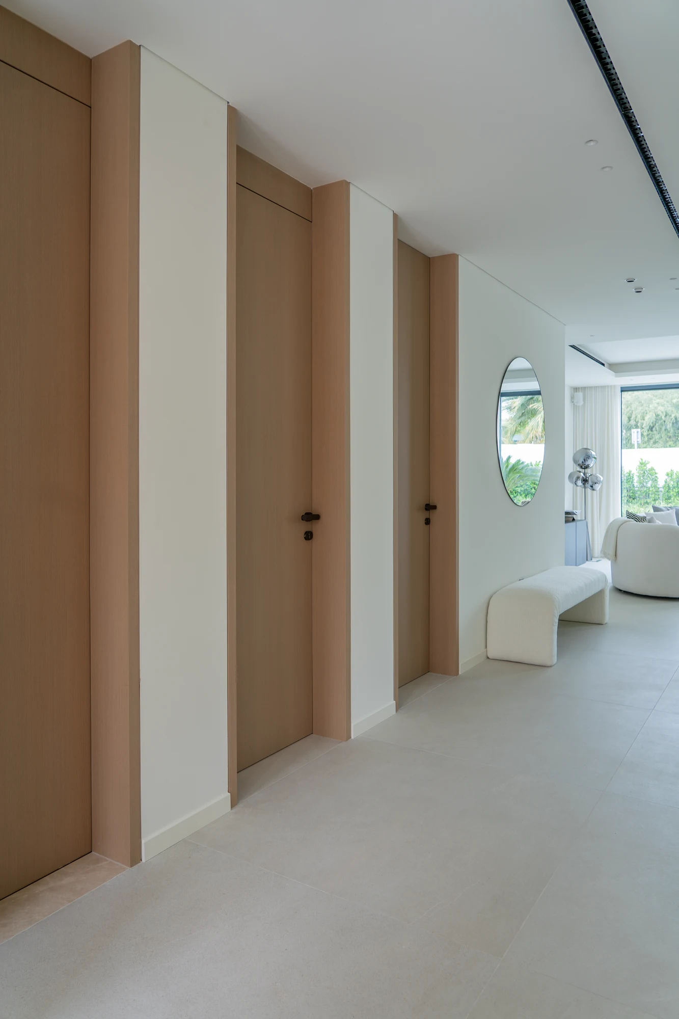 Coordinated tall interior doors along the villa corridor