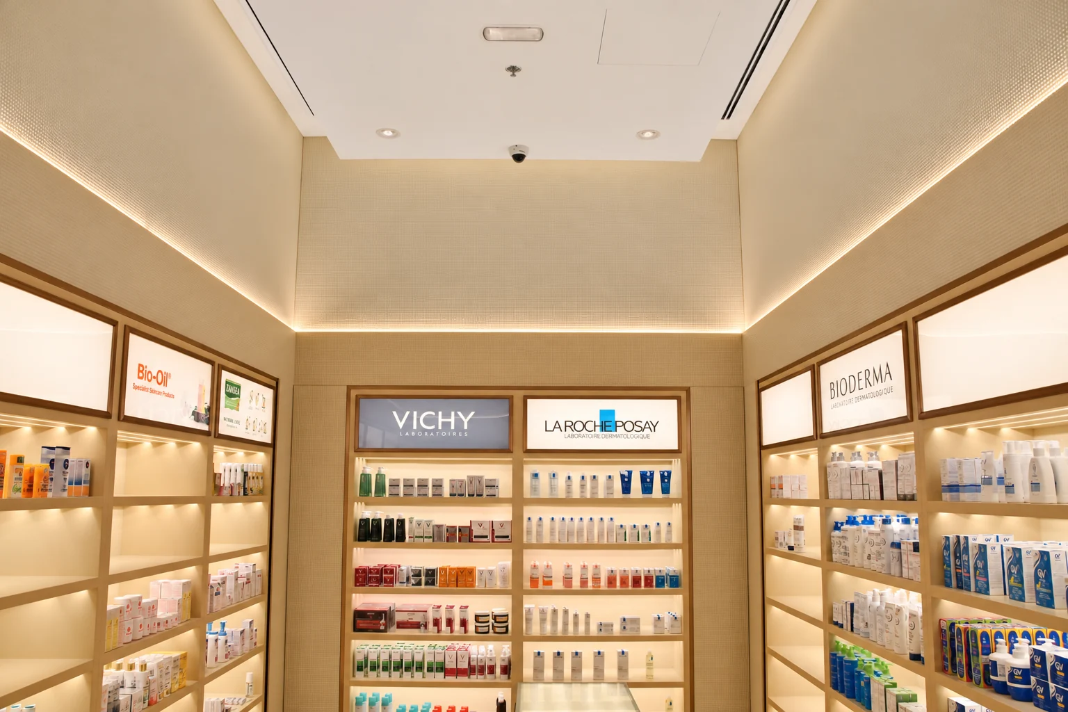 Illuminated bespoke shelving and display joinery in the Muscat Pharmacy skincare alcove