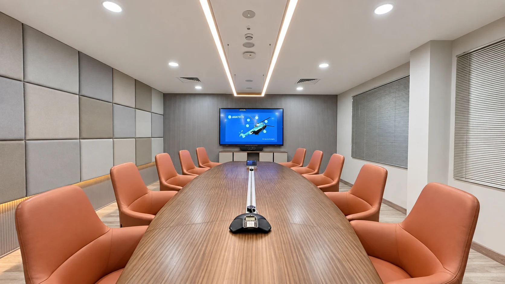 AAA Tech conference room with timber meeting table, terracotta chairs and upholstered wall panels