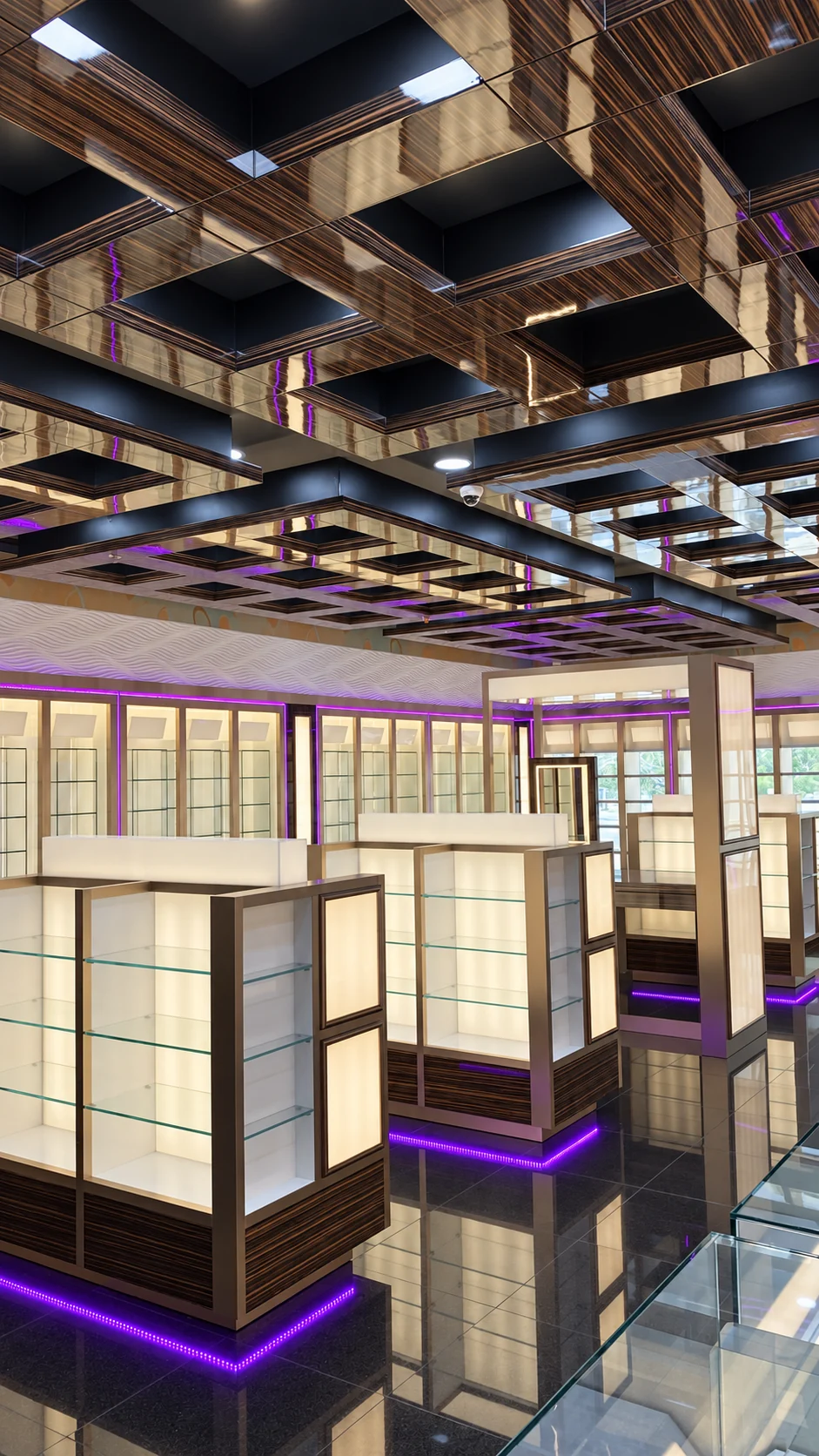 Illuminated showroom display islands beneath a detailed timber ceiling