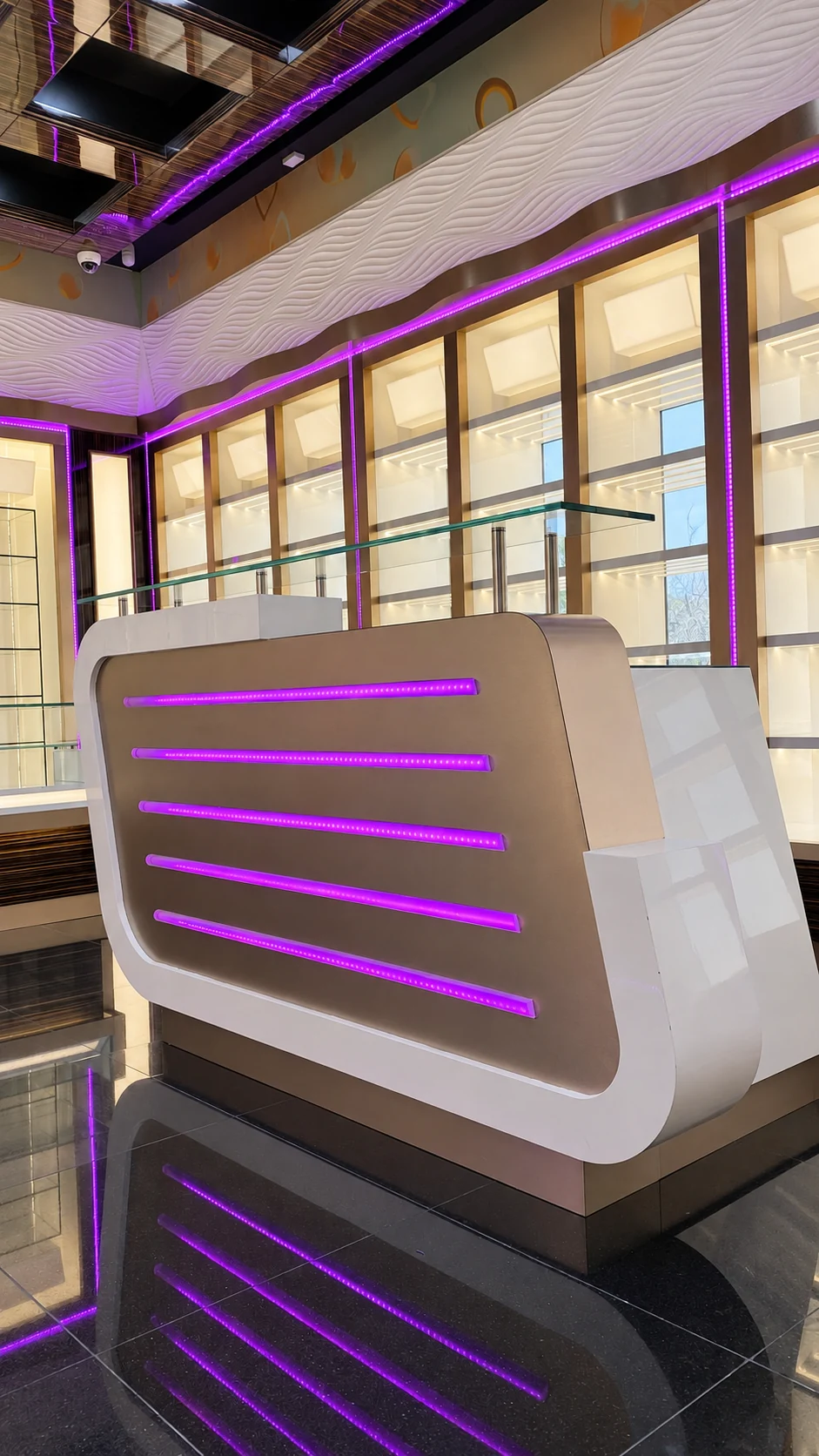 Bespoke curved showroom counter with purple integrated lighting
